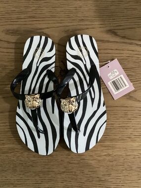 Cute tiger flip flops, new with tags, size 9